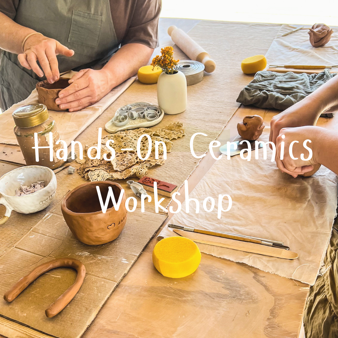 Ceramics workshop with hands-on activity on a wooden table.