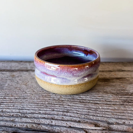 Small ceramic bowl with a purple rim